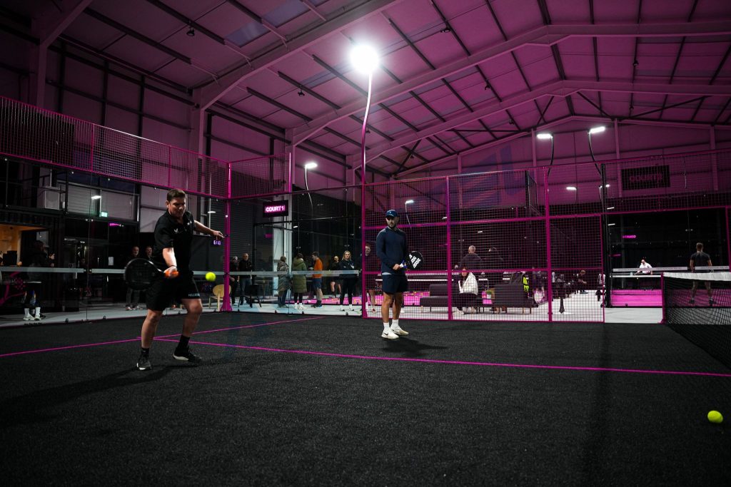 black turf and pink metal structure padel court, panoramic padel court