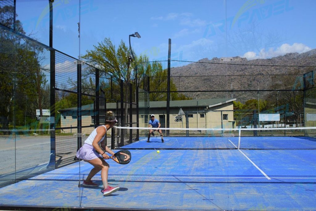 double padel court,
blue turf and black metal structure